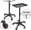 Two salon trolleys with trays and wheels are shown against a white background. One trolley is in the foreground and the other is in the background. A close-up of a wheel is shown in the bottom left corner. A close-up of a tray is shown in a red circle on t Podgląd zdjęcia produktu