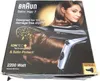 The image shows the packaging of a Braun Satin Hair 7 hair dryer, featuring a model and product details. Produktbild-Vorschau