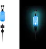 A product shot of a blue fishing bite alarm, shown both on a white background and illuminated against a black background. Produktbild-Vorschau
