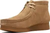 A close-up studio shot of a single brown suede boot. Produktbild-Vorschau