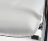 A close-up view of the white seat of a chair, showing the stitching and texture of the material. Náhled obrázku produktu