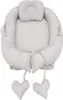 A baby nest with a headrest and two heart-shaped pillows attached by strings. Produktbild-Vorschau