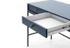 A close-up view of a blue desk with one drawer pulled out, showing the interior and drawer slides. Voir les images du produit
