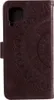 A brown flip case for a Samsung Galaxy A22 4G phone with a mandala pattern embossed on the cover. Produktbild-Vorschau