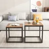 Two square coffee tables with a wood-look top and black metal legs are placed on a rug in front of a sofa. Podgląd zdjęcia produktu