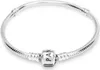 A silver Pandora bracelet with a central charm is displayed on a white background. Náhľad obrázku produktu