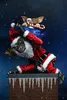 Two Gremlins characters dressed as Santa Claus and a helper, one carrying a sack of gifts, on a chimney top during a snowy night. Produktbild-Vorschau