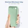 A hand holding a light green phone case against a white background. Produktbild-Vorschau