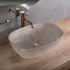 A modern bathroom sink with a copper faucet. Náhled obrázku produktu