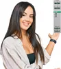 A woman is presenting an electronic relay. Podgląd zdjęcia produktu