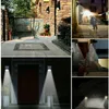 A collage of images showing solar-powered wall lights installed in various outdoor settings, including a garden, a pathway, and a garage. Voir les images du produit
