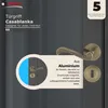 A close-up marketing image of a bronze door handle set against a dark gray background, with text overlays highlighting features and warranty information. Produktbild-Vorschau