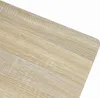 A close-up view of a light wood-grain surface with a rounded edge. Náhled obrázku produktu