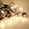A close-up view of a string of clear, round LED light bulbs. Anteprima dell’immagine prodotto