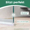 Close-up of a shower door seal on a wooden floor, showing water droplets. Podgląd zdjęcia produktu