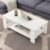 A white coffee table with a laptop and a vase on it, placed in a living room setting next to a sofa. Náhled obrázku produktu