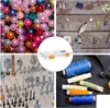 A collage of four images showing various craft and hardware items, including beads, fishing lures, screws, and spools of thread, with a clear plastic sorting box in the center. Voir les images du produit