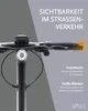 Close-up of an electric scooter's handlebars with text highlighting visibility features. Produktbild-Vorschau