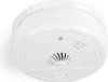 A white smoke detector is shown from a slightly elevated angle against a white background. Podgląd zdjęcia produktu