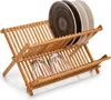 A wooden dish rack holding plates and glasses. Produktbild-Vorschau