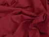 A close-up shot of rumpled burgundy fabric. Produktbild-Vorschau