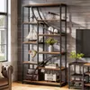 A tall, industrial-style bookshelf filled with decorative items in a living room setting. Voir les images du produit