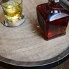 A glass of whiskey and a bottle of whiskey on a wooden surface. Náhled obrázku produktu