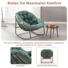A green rocking chair with a cushioned seat and a small side table next to it, set in a room with a window. Produktbild-Vorschau