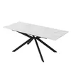 A white rectangular dining table with a marble-like pattern and black X-shaped legs, shown against a white background. Náhled obrázku produktu