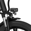 Close-up of the front fork and wheel of a black electric bicycle, showing a mounted headlight and a small fender. Voir les images du produit