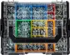A top-down view of a clear plastic organizer box filled with various screws, nuts, and washers, with colored dividers. Produktbild-Vorschau