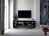 A modern living room with a TV mounted on the wall above a black TV cabinet filled with books and decorative items. A large window with grey curtains is on the left. Produktbild-Vorschau