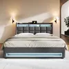 A modern upholstered bed with integrated LED lighting and a charging station. Produktbild-Vorschau