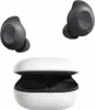 A pair of black wireless earbuds and their white charging case are displayed against a white background. Podgląd zdjęcia produktu