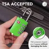 A hand holding a green TSA-accepted luggage lock in front of a suitcase. Produktbild-Vorschau