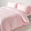 A close-up view of pink bedding with a striped pattern. Náhled obrázku produktu