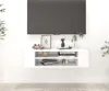 A white TV stand mounted on a white wall, with a TV mounted above it. Náhled obrázku produktu