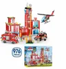 A toy fire station building set with vehicles and a helicopter, along with its packaging box. Anteprima dell’immagine prodotto
