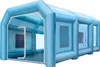 A light blue inflatable spray booth is shown from the side, with the entrance visible on the left. Náhľad obrázku produktu