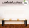 A bench with white seat cushions in front of a white wall with a white rectangular panel above it. The bench has wooden slats and black legs. Text and a logo are in the upper right corner. Produktbild-Vorschau