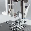 Close-up view of a sewing machine needle and presser foot with blue thread. Produktbild-Vorschau