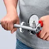 A person is using a pipe cutter to cut a gray pipe. Produktbild-Vorschau