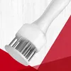 A close-up shot of a white meat tenderizer with stainless steel needles against a background of white wood grain and red geometric shapes. Produktbild-Vorschau
