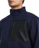 Close-up of a man wearing a navy jacket with a black panel on the chest. Voir les images du produit