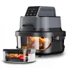 A multi-functional air fryer with a transparent glass container showing food inside, and a smaller transparent container with food in the foreground. Produktbild-Vorschau