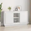 A white sideboard is shown in a room with a plant and some decorative items on top. Náhľad obrázku produktu