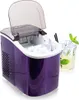 A purple ice maker with its lid open, showing ice cubes inside. A glass of iced drink with mint is next to it. Produktbild-Vorschau