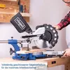 A person is using a miter saw in a workshop setting. Voir les images du produit