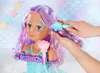 A doll's styling head with colorful hair, being styled with a brush. Voir les images du produit
