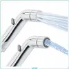 Two chrome-plated bidet sprayers are shown, each spraying water. The background is white. Anteprima dell’immagine prodotto